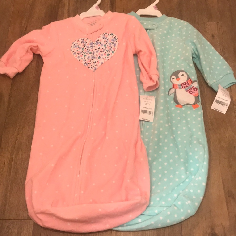 Carter’s baby sleeping bags (both included)